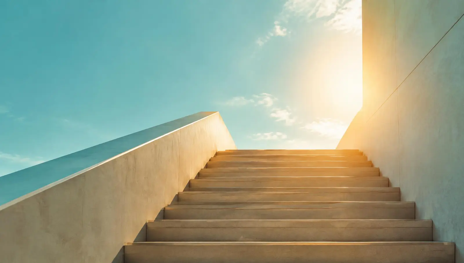Sunlit staircase rising toward a bright sky, symbolizing upward business growth
